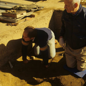 Archaeologists William Leigh and Ivor Noël Hume excavating the cabasset helmet.