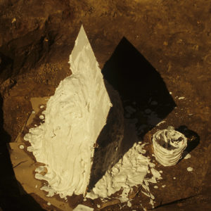 The cabasset helmet and surrounding soil was encased in plaster to stabilize the assemblage during transport to the lab.