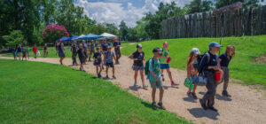 Kids Camp attendees and archaeologists on the path north of James Fort