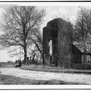 Black and white photograph of church tower, path, and barn