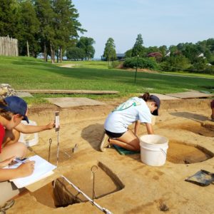 Students excavating and recording features