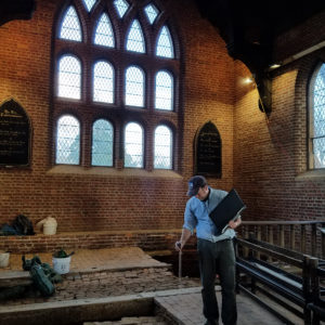 Archaeologist maps features inside brick church