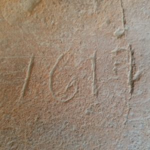 1617 scratched into a tile