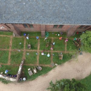 Aerial view of excavation unit next to brick church