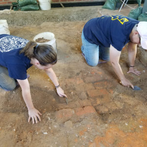 Excavators trowel brick floor