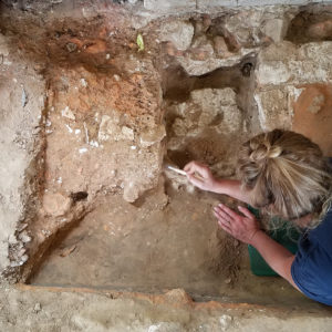 Archaeologist excavates church floor