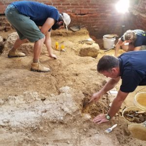 Archaeologists excavate church floor