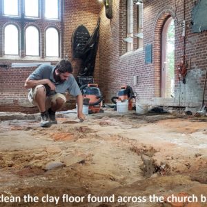 Archaeologists excavate dirt church floor