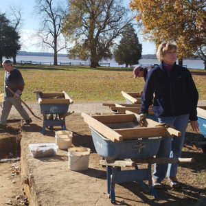 Archaeologists excavate near river bank