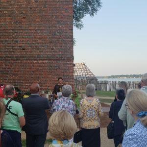 Community members gather for a wreath-laying ceremony at the Church Tower the morning of July 30, 2019
