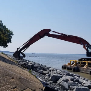 Installation of armourstone to protect the seawall