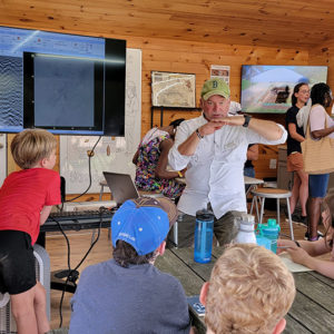 Director of Archaeology David Givens teaches the campers how to read GPR data.
