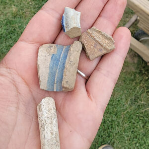 Ceramic sherds and a pipe stem found in the north field excavations