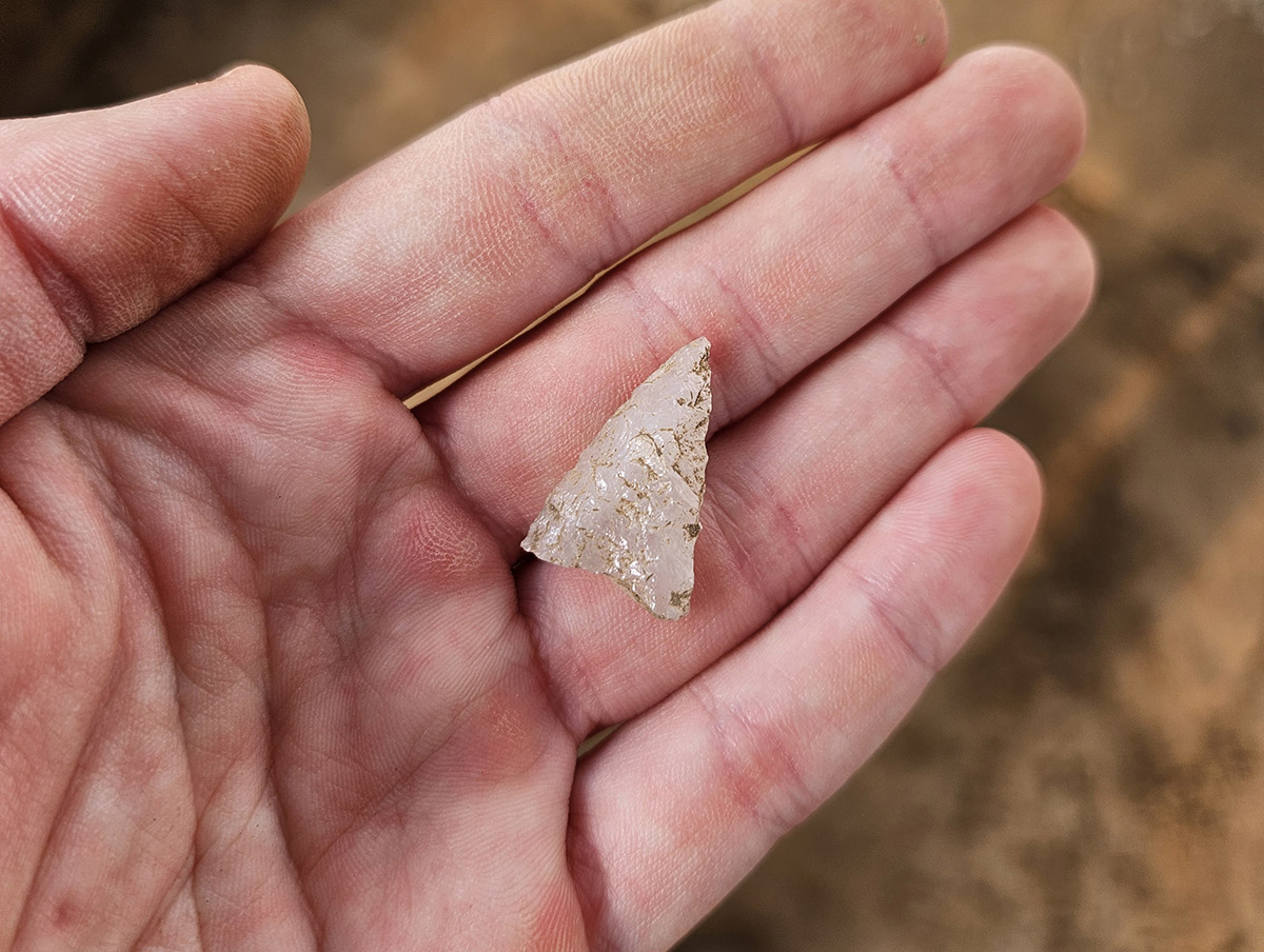 A quartz projectile point found in the excavations adjacent to the ticketing tent