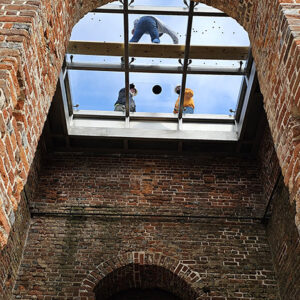 Contractors working on the Church Tower's glass roof