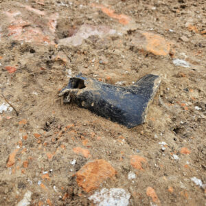 Another view of the wine bottle neck found south of the Archaearium