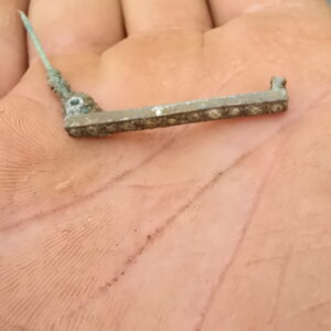 A decorative copper bar pin found in the excavations outside the Church Tower. It likely dates to the late 19th century.