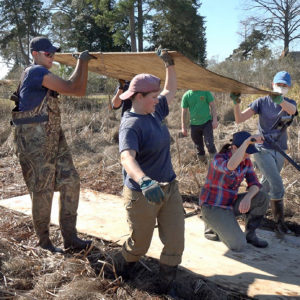 Kalen Anderson and members of the archaeological team conduct a ground-penetrating radar survey on part of the swamp at Jamestown.