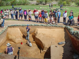 Visitors listen to Staff Archaeologist Natalie Reid explain the Governor's Well and 1608 ditch excavations.