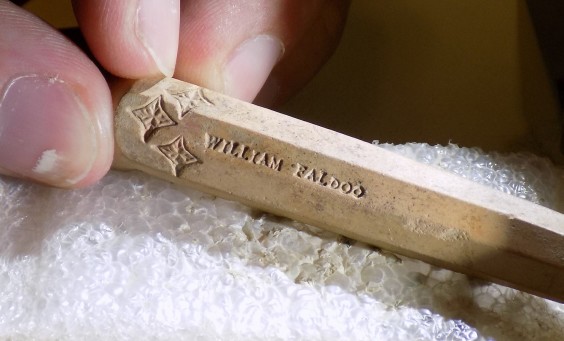 Pipe stem fragment stamped with name William Faldo