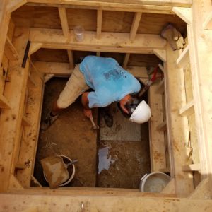 Archaeologist excavating in a well