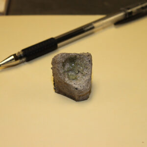 A crucible fragment found in the fort's first well. Melted glass adheres to the vessel.