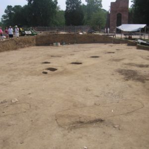 Large excavation with outlined grave shafts