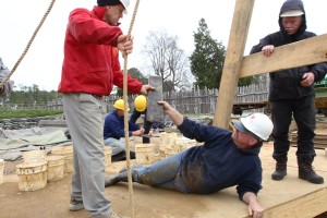 Archaeologists pass artifact up from well