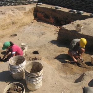 Archaeologists excavating a cellar