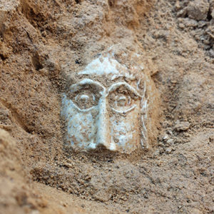 Bartmann jug sherd decorated with molded face in situ