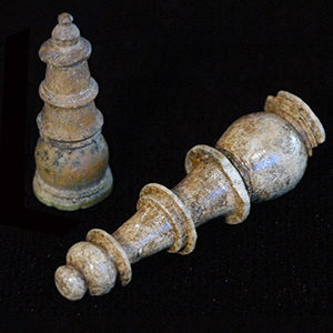 Two carved bone chess pieces