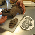 Conserved gauntlet with image of contemporaneous example