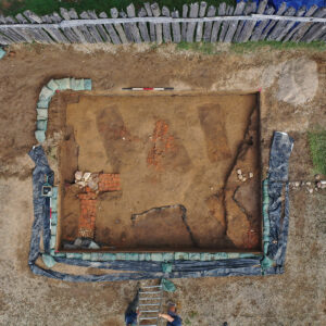 A drone photo of the area of the 1607 burial ground containing the three graves to be excavated this fall (the three roughly parallel dark rectangles).