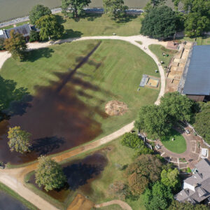 Flooding of Smithfield, September 23, 2024. The burial excavation south of the Archaearium is the sandbag lined square at right closest to the center of the photo.