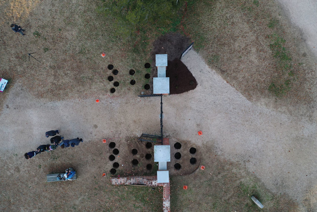 Drone shot of the holes at the Preservation Virginia gate. These holes were excavated to test for archaeological resources precisely where the plants were to be installed.