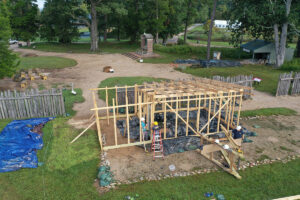 The archaeological team builds the burial structure that will protect the human remains at the 1607 burial ground during excavations.