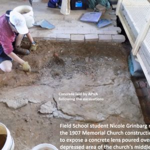Excavator trowels in exposed dirt floor