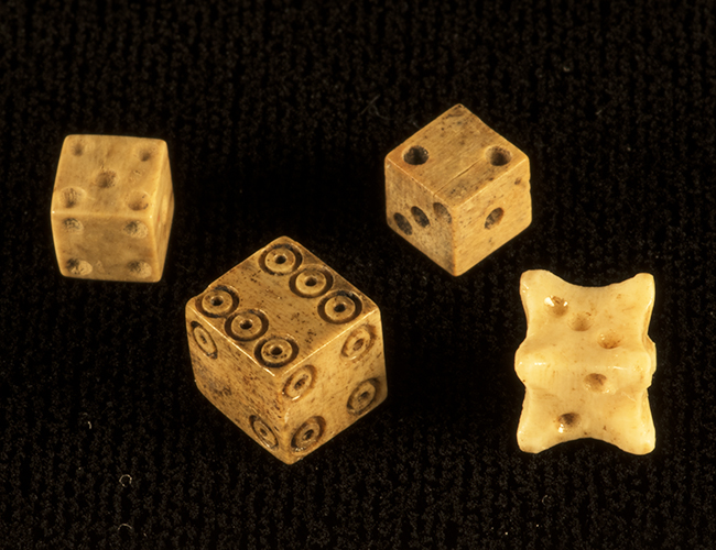 Four bone dice