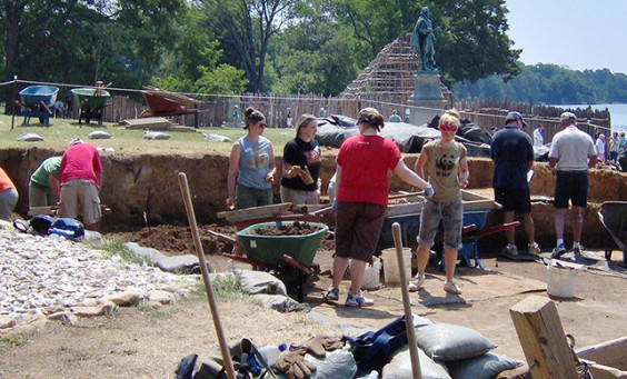 Archaeologists and students excavating
