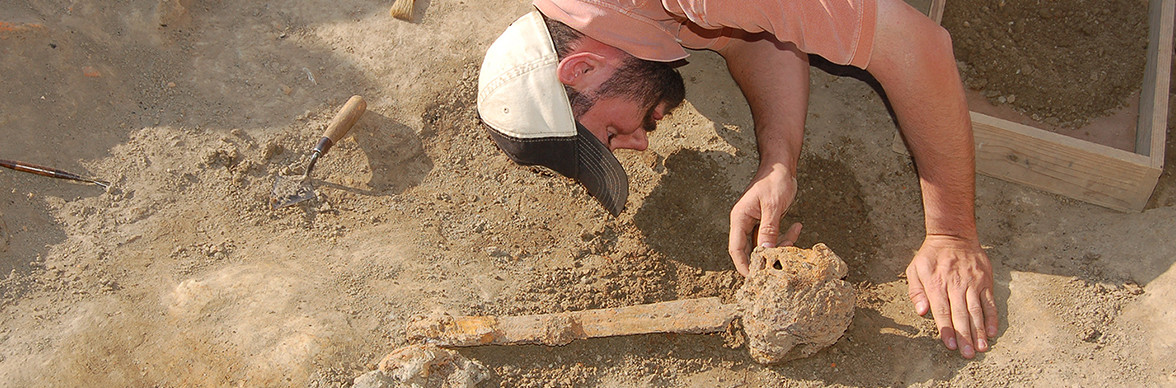 Archaeologist excavating a sword