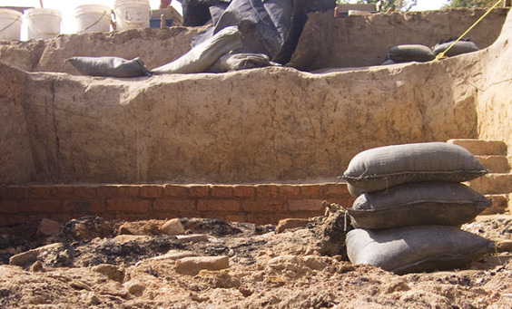 Sandbag and excavated brick wall of excavated cellar