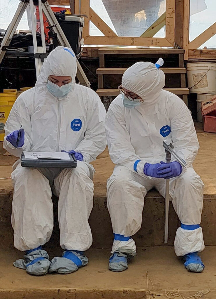 Associate Curator Emma Derry and Biological Anthropologist Dr. Ashley McKeown record the dimensions of one of the colonists interred in the 1607 burial ground.