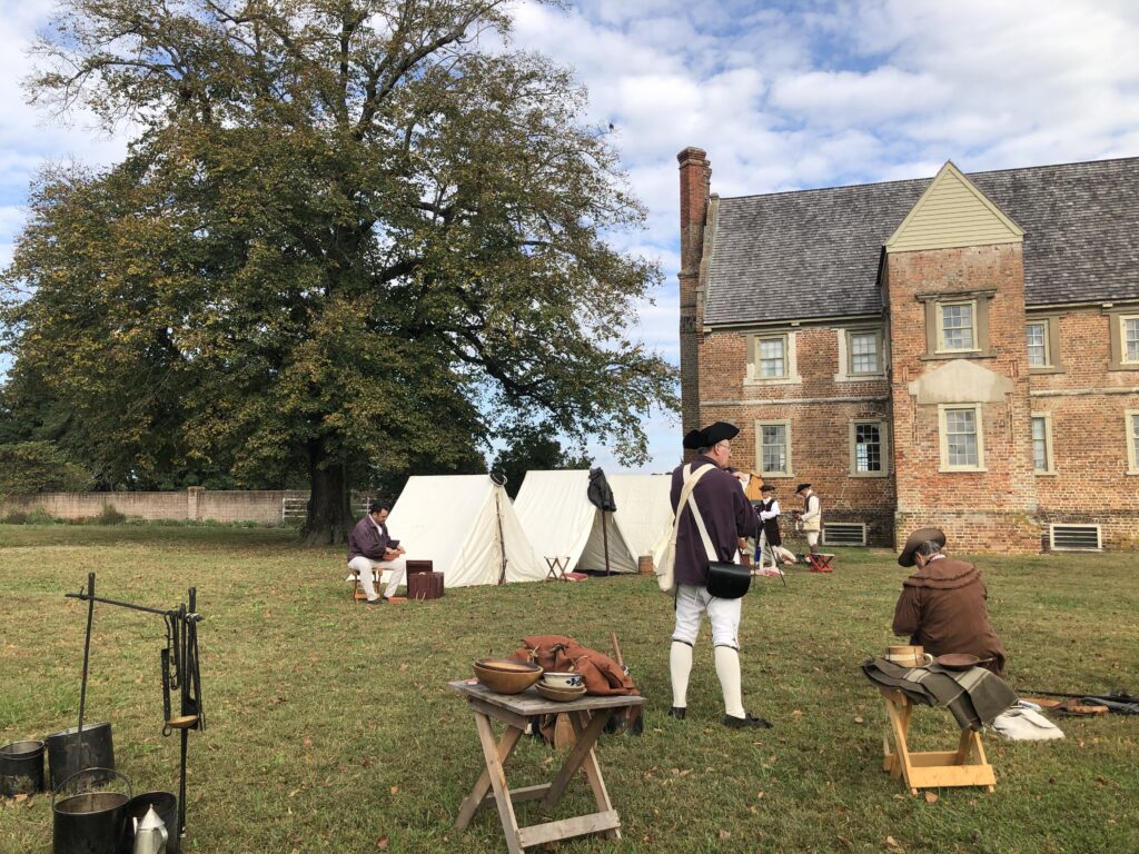 Historic interpreters in a military encampment at Bacon's Castle