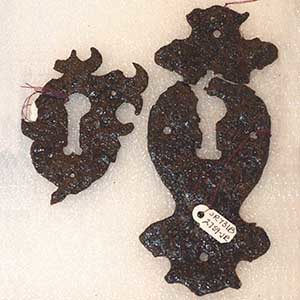two iron escutcheons