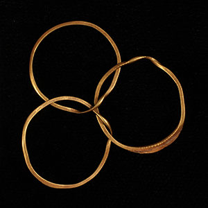 Three joined gold rings