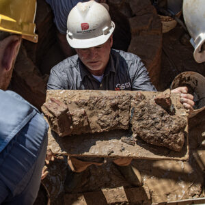 Director of Archaeology David Givens holds the saw blade fragments found in the Governor's Well.