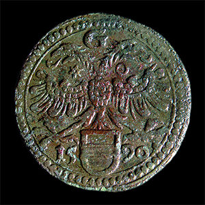 copper alloy token displaying a double-headed eagle