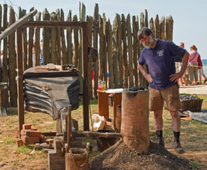 Blacksmith Shel Browder works at an iron bloomery just outside James Fort.