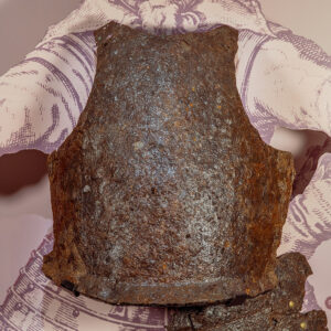 The breastplate in the Archaearium before undergoing additional conservation.