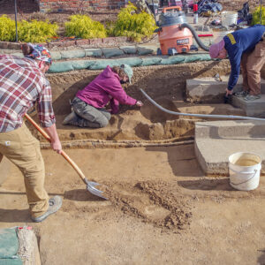 Archaeological Field Technician Josh Barber and Staff Archaeologists Ren Willis and Caitlin Delmas at work in the excavations west of the Church Tower.